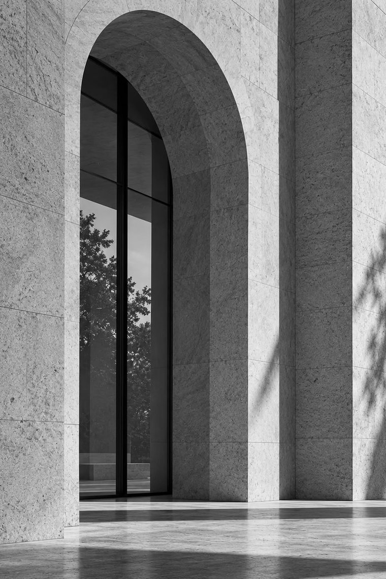 Arched window in a stone facade
